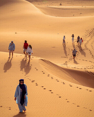 Is a 3 Day Desert Tour from Marrakech Worth It? (Honest Guide for 2025)Target Keyword: 3 day desert tour from Marrakech Secondary Keywords: Marrakech to Merzouga 3 days, 3 day Sahara tour Morocco, Merzouga desert tour, is Merzouga worth it Suggested URL: /blog/3-day-desert-tour-from-marrakech-worth-it/ Meta Description: Wondering if a 3 day desert tour from Marrakech is worth your time? This honest guide covers exactly what to expect, what's included, and why Merzouga is unmissable.IntroductionYou've got three days. You're in Marrakech. And somewhere in the back of your mind is an image that pulled you to Morocco in the first place — a camel silhouetted against a burning orange dune, a sky so full of stars it looks painted, a silence so complete it feels physical.The question is whether a 3 day desert tour from Marrakech can actually deliver that experience — or whether three days is too rushed to make it worthwhile.The short answer is yes, it is absolutely worth it. But the longer answer — the one that actually helps you decide, plan, and get the most out of it — is what this guide is for.We'll cover everything: what the route looks like, what you'll actually see and do, what kind of accommodation to expect, how much it costs, and the honest trade-offs of doing the desert in three days versus four or five. By the end, you'll know exactly whether this tour is right for you.What Is a 3 Day Desert Tour from Marrakech?A 3 day desert tour from Marrakech is a guided road journey that takes you from Marrakech southeast through the High Atlas Mountains, across the pre-Saharan valleys, and into the Merzouga desert region — home to the famous Erg Chebbi dunes — before returning you to Marrakech on Day 3.The standard route covers approximately 1,000 kilometers round trip and is done in a private 4x4 or minivan with a local driver-guide. Most tours include accommodation, meals, a camel ride, and an overnight stay in a desert camp.The classic itinerary runs as follows:Day 1: Marrakech → Tizi n'Tichka Pass → Ait Ben Haddou → Dades Valley Day 2: Dades Valley → Todra Gorge → Merzouga Desert Camp Day 3: Merzouga → Draa Valley → Ouarzazate → MarrakechWhat You'll See: A Destination-by-Destination BreakdownThe Tizi n'Tichka PassYour journey begins immediately with one of the most dramatic drives in North Africa. The High Atlas Mountains rise sharply from the Marrakech plain, and the road to the Tizi n'Tichka Pass — Morocco's highest paved mountain road at 2,260 meters — is a masterclass in mountain scenery. Switchback after switchback reveals new panoramas of snow-capped peaks (in winter and spring), ancient Berber villages clinging to ridgelines, and valleys so deep they look carved by giants.Allow 2–3 hours from Marrakech to the pass with photo stops. The drive alone is worth the early morning departure.Ait Ben Haddou KasbahNo stop on the Marrakech to Merzouga 3 day route generates more genuine awe than Ait Ben Haddou. This UNESCO World Heritage Site is a fortified ksar (walled village) of extraordinary earthen architecture — towers, granaries, and alleyways built from the red clay of the Ounila River valley, layered and sculpted over centuries into something that looks less like a human settlement and more like a geological formation that learned to organize itself.It has been used as a film location for more productions than almost anywhere outside Hollywood: Gladiator, Lawrence of Arabia, Game of Thrones, The Mummy, Babel, Prince of Persia, and dozens more. Your guide will point out the specific locations — the gladiator arena, Daenerys's slave city, the Roman aqueduct that isn't Roman at all — and the layers of history between the film shoots become even more interesting than the films themselves.Allow 1.5–2 hours for a proper visit. Entrance fee is approximately 10–15 MAD.The Dades ValleyOvernight on Day 1 is typically in the Dades Valley — a spectacular canyon landscape of red rock gorges, rose villages, and mud-brick guesthouses perched above the Dades River. The valley's most famous feature is a section of dramatically folded rock near Boumalne Dades where the cliffs have been twisted and compressed into finger-like formations locals call "monkey fingers." The evening light on these formations — going from amber to deep red to purple as the sun sets — is one of the great unsung spectacles of southern Morocco.Todra GorgeDay 2 brings Todra Gorge — a slot canyon near Tinghir where the limestone walls rise to 300 meters and close to barely 10 meters apart. Walking the floor of the gorge as the light shifts through the narrow opening is one of those experiences that converts even reluctant hikers into gorge enthusiasts. The cold, clear Todra River runs along the canyon floor; local women often do laundry in the shallows; and rock climbers from around the world come specifically for the vertical faces that line the upper canyon.Allow 45–60 minutes. The gorge itself is free to walk; parking fees are nominal.The Erg Chebbi Dunes, MerzougaThis is the moment the whole tour builds toward. The Erg Chebbi dune field near Merzouga is one of only two true erg (sand sea) formations in Morocco — a field of enormous, wind-sculpted dunes reaching heights of up to 150 meters, covering an area of approximately 50 square kilometers. The dunes shift color throughout the day from pale gold in the morning to deep orange and then burning crimson at sunset.Your camel ride into the dunes typically takes 45–60 minutes and arrives at your desert camp just as the last light fades. This is one of the most reliably memorable moments in Moroccan travel — and it consistently exceeds expectations even for travelers who worried they'd built it up too much.The Desert Camp Experience: What to Actually ExpectThe quality of desert camps in Merzouga varies enormously, and the word "luxury" is used with great creative freedom by some operators. Here is what a genuinely good desert camp should include:Accommodation: Private tents with proper beds (not just mattresses on the floor), quality blankets (desert nights are cold even in summer), and ideally an en-suite or nearby bathroom with a functioning toilet and hot shower.Food: A traditional Moroccan dinner — typically a vegetable or meat tagine, harira soup, Moroccan salad, and fresh bread — served communally in the dining tent. Breakfast the following morning should include coffee, mint tea, bread, olive oil, honey, and jam at minimum.Entertainment: Most camps include an evening of Gnawa or Berber music around the campfire. The music is genuine and the atmosphere is unlike anything you'll find in a city restaurant.Stargazing: The Merzouga desert sits in one of the darkest sky zones in North Africa. On a clear night with no moon, the Milky Way is visible to the naked eye with a clarity that most travelers from urban environments have never experienced. This alone justifies the entire journey.What to bring: Warm layers (even in summer, desert nights drop sharply), a headtorch, any medication you need, a power bank (electricity is available in most camps but charging points are limited), and cash for tips.3 Days vs 4 Days vs 5 Days: Which Is Right for You?This is the most common question travelers ask before booking, and the honest answer depends entirely on what you want from the experience.3 days is the right choice if you have limited time, if you've already seen the High Atlas and southern valleys before, or if the desert itself is the primary draw and you're happy to move at pace through the stops along the way. You will see everything on the standard route and the desert experience is complete — camel ride, overnight camp, and sunrise. Nothing essential is missing.4 days adds either a second night in the desert (our recommended upgrade) or ends in Fes rather than returning to Marrakech, which is ideal if you're traveling one-way between Morocco's two great cities. The extra day transforms the desert from a highlight into an experience — you have time to slow down, explore the dune field more deeply, and visit places like Khamlia village and Merzouga Lake that the 3 day tour doesn't reach.5 days or more is for travelers who want the full southern Morocco experience — adding the Draa Valley, Telouet Kasbah, Skoura, and the Amridil Kasbah to an already rich itinerary, or extending the journey all the way to Fes and beyond. If this is your first trip to Morocco and you have the time, a 5 day tour is the most rewarding investment you can make.How Much Does a 3 Day Desert Tour from Marrakech Cost?Prices vary significantly depending on group size, accommodation quality, and whether you book a private or shared tour.Shared group tours (typically 6–12 people in a minivan): €80–€150 per person for the full 3 days including accommodation and meals. Budget end means basic guesthouses and a standard camp; mid-range means comfortable riads and a proper luxury camp.Private tours (your own vehicle and guide, just your group): €200–€450 per person depending on group size. The smaller your group, the higher the per-person cost — but the experience is incomparably better. You stop when you want, linger where you choose, and the guide's attention is entirely yours.What's typically included: Transport, accommodation, daily breakfast and dinner, camel ride, and entrance fees. What's typically not included: Lunches, alcoholic drinks, personal tips for your guide and camel handler, and any optional activities.Practical Tips for Getting the Most Out of Your TourBook a private tour if you can. The cost difference is genuinely worth it. A private guide brings the landscapes and history to life in a way that a group tour — where the guide is managing twelve different people's questions and schedules — simply cannot match.Request a specific camp before you book. Ask your tour operator the name of the desert camp they use and look it up independently. This is the single best way to ensure the camp matches what the brochure promises.Pack light but pack warm. Desert days are hot; desert nights are cold. A thin down jacket or a warm fleece is essential even in summer. In winter (December to February) bring serious warm layers — temperatures at night can drop below 5°C.Tip your guide and camel handler generously. Driver-guides on these tours are among the most knowledgeable and hardworking people in the Moroccan tourism industry. A tip of €10–€20 per day for your guide and 20–30 MAD per camel ride for the handler is appropriate and genuinely appreciated.Get up for the sunrise. This is non-negotiable. Set an alarm, dress warmly, and climb the nearest dune crest before dawn. The 20 minutes between first light and full sunrise over the Erg Chebbi dunes is the single most reliably beautiful moment of any 3 day Sahara tour Morocco — and travelers who sleep through it consistently regret it.Final Verdict: Is It Worth It?Without question. A 3 day desert tour from Marrakech is one of the best-value, highest-impact travel experiences available in North Africa. The landscapes are genuinely extraordinary. The cultural encounters — with Berber guides, desert camp hosts, and the communities of the southern valleys — are authentic and memorable. And the desert itself, once you're actually in it, almost always exceeds whatever you imagined.Three days is enough to feel the Sahara properly. It's not enough to know it deeply — that takes longer — but it is absolutely enough to be changed by it.Ready to book? Explore our 3 Day Desert Tour from Marrakech to Merzouga and check available dates for your trip.